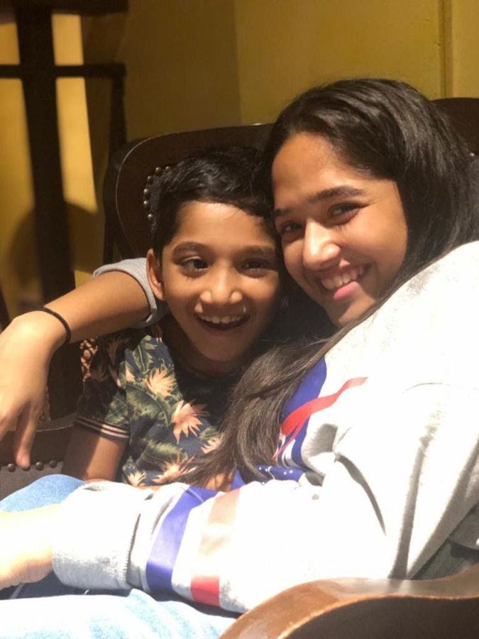 Aadya and Aadi smiling for a selfie.